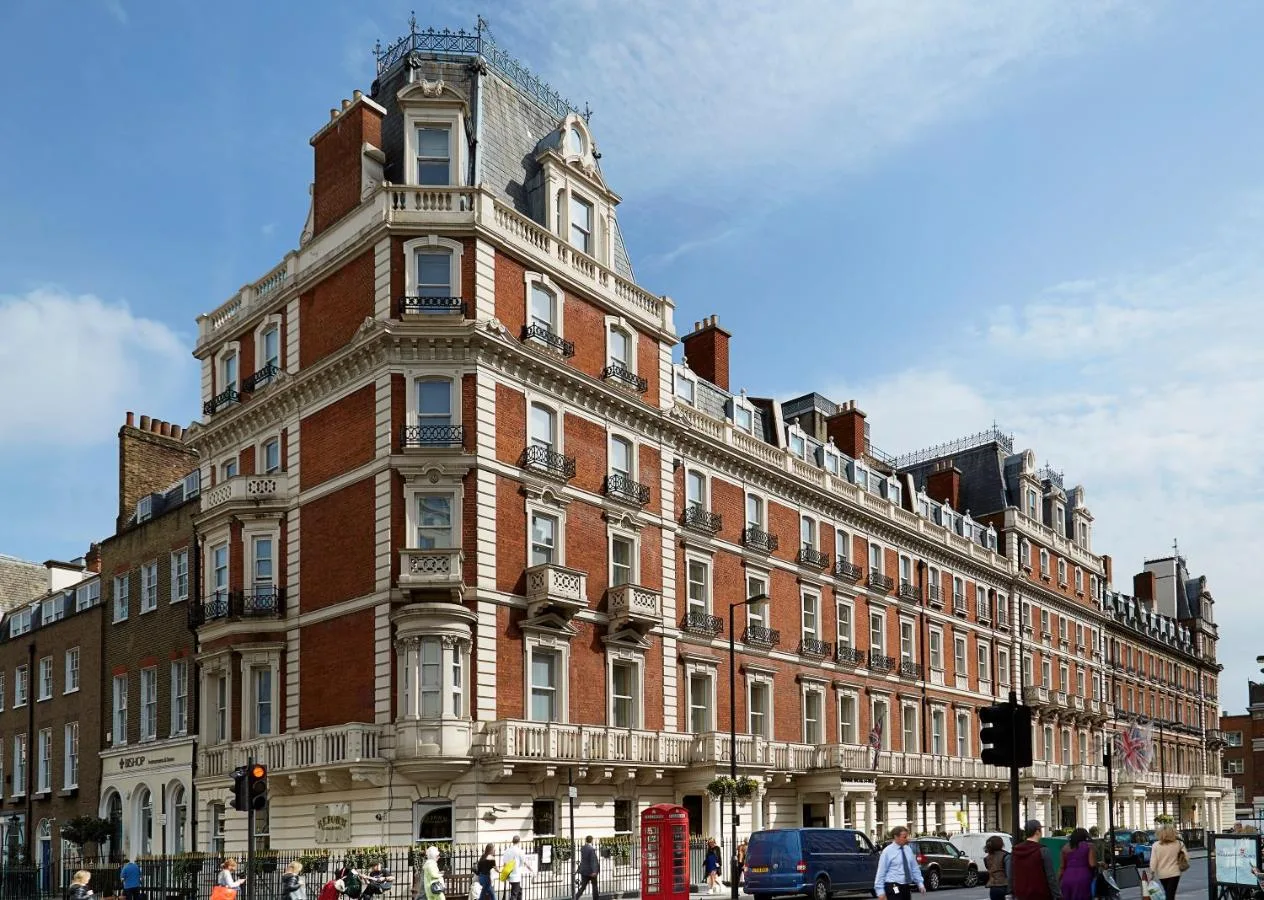 a large red brick building on a city street at The Mandeville Hotel in London